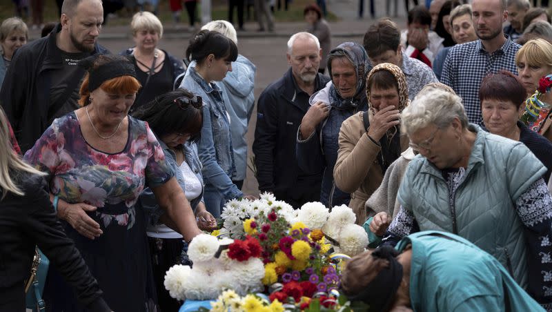 Local residents come to pay their respects to a Ukrainian soldier, Andrii “Adam” Grinchenko of the 3rd Assault Brigade, who was injured in the battle for Andriivka during a funeral ceremony in Shostka, Sumy region, Ukraine, on Tuesday, Sept. 26, 2023. Hundreds of people came to say goodbye to the 31-year-old Grinchenko in his hometown of Shostka.