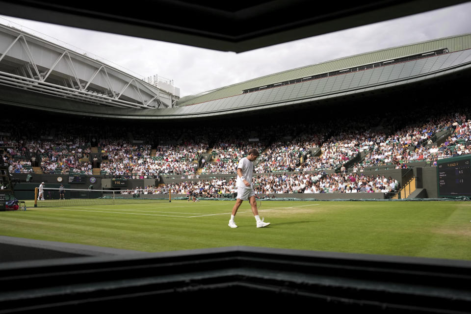 Britain's Cameron Norrie prepares to serve to Tommy Paul of the US during a men's fourth round singles match on day seven of the Wimbledon tennis championships in London, Sunday, July 3, 2022. (AP Photo/Alberto Pezzali)