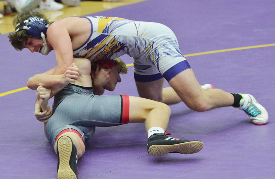 Watertown's Derek Hanson flips Brookings' Sawyer Johnson at 132 pounds during an Eastern South Dakota Conference boys wrestling dual on Thursday, Dec. 14, 2023 in the Civic Arena.