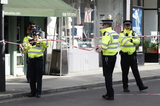 Police put up cordon tape outside the Tube station at Parsons Green  (AP/Kirsty Wigglesworth)