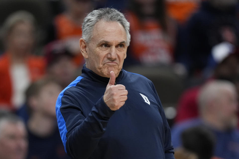 Duquesne head coach Keith Dambrot signals to his team as they played against BYU in the first half of a first-round college basketball game in the NCAA Tournament, Thursday, March 21, 2024, in Omaha, Neb. (AP Photo/Charlie Neibergall)