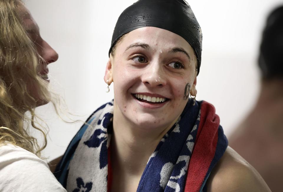 Olympus High School senior Maddy Parker is congratulated after setting a new state record at the 5A state swimming meet at BYU in Provo on Saturday, Feb. 18 2023. | Laura Seitz, Deseret News