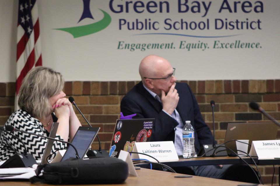 Green Bay School Board Vice President James Lyerly and Board Member Laura Laitinen-Warren listen during a board meeting June 5, 2023 in Green Bay, Wisconsin.