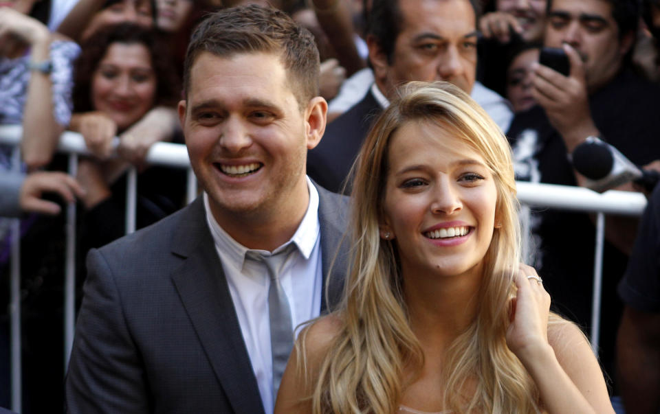 FILE - This March 31, 2011 file photo shows Canadian pop star Michael Buble, left, and Argentine actress Luisana Lopilato in Buenos Aires, Argentina. The 37-year-old Canadian singer and his 25-year-old Argentine actress-wife are expecting a baby. They were married in 2011. The couple met in 2009 during a South American concert tour. (AP Photo/Natacha Pisarenko, file)