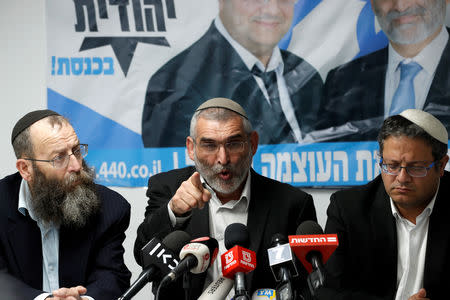 Michael Ben-Ari from the Jewish Power party delivers a statement to the media together with his party's members, Baruch Marzel and Itamar Ben-Gvir in Jerusalem, March 17, 2019. REUTERS/Ronen Zvulun
