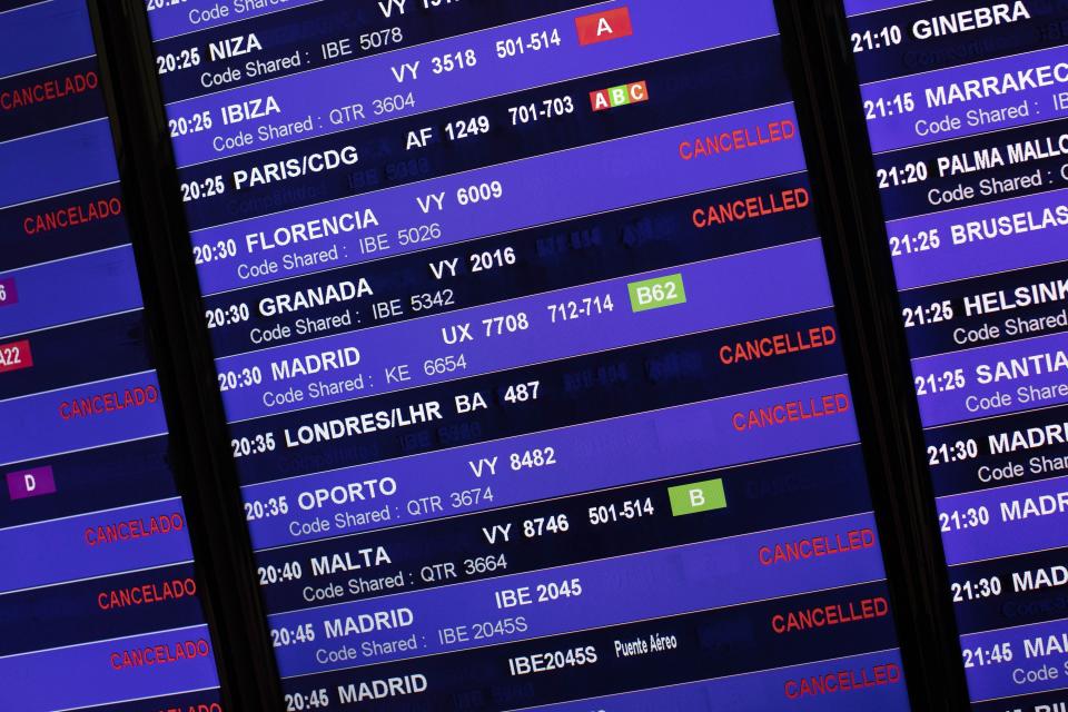 Information panel shows canceled flights at El Prat airport, outskirts of Barcelona, Spain, Monday, Oct. 14, 2019. Spain's Supreme Court on Monday sentenced 12 prominent former Catalan politicians and activists to lengthly prison terms for their roles in a 2017 bid to gain Catalonia's independence, sparking protests across the wealthy Spanish region. (AP Photo/Bernat Armangue)