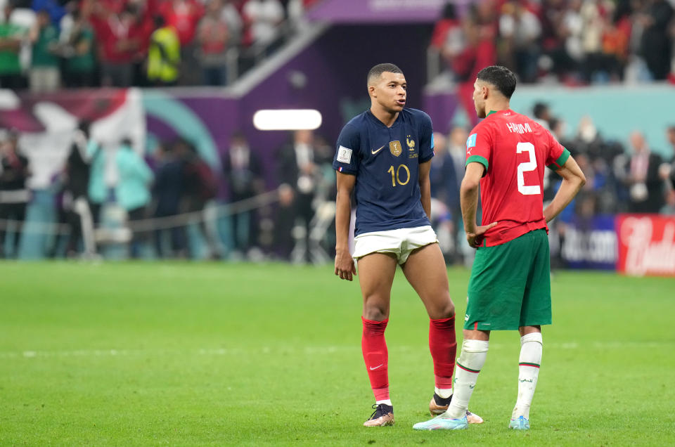 AL KHOR, QATAR - DECEMBER 14: Kylian Mbappe of France greets Achraf Hakimi of Morocco after the victory ,during the FIFA World Cup Qatar 2022 semi final match between France and Morocco at Al Bayt Stadium on December 14, 2022 in Al Khor, Qatar. (Photo by MB Media/Getty Images)