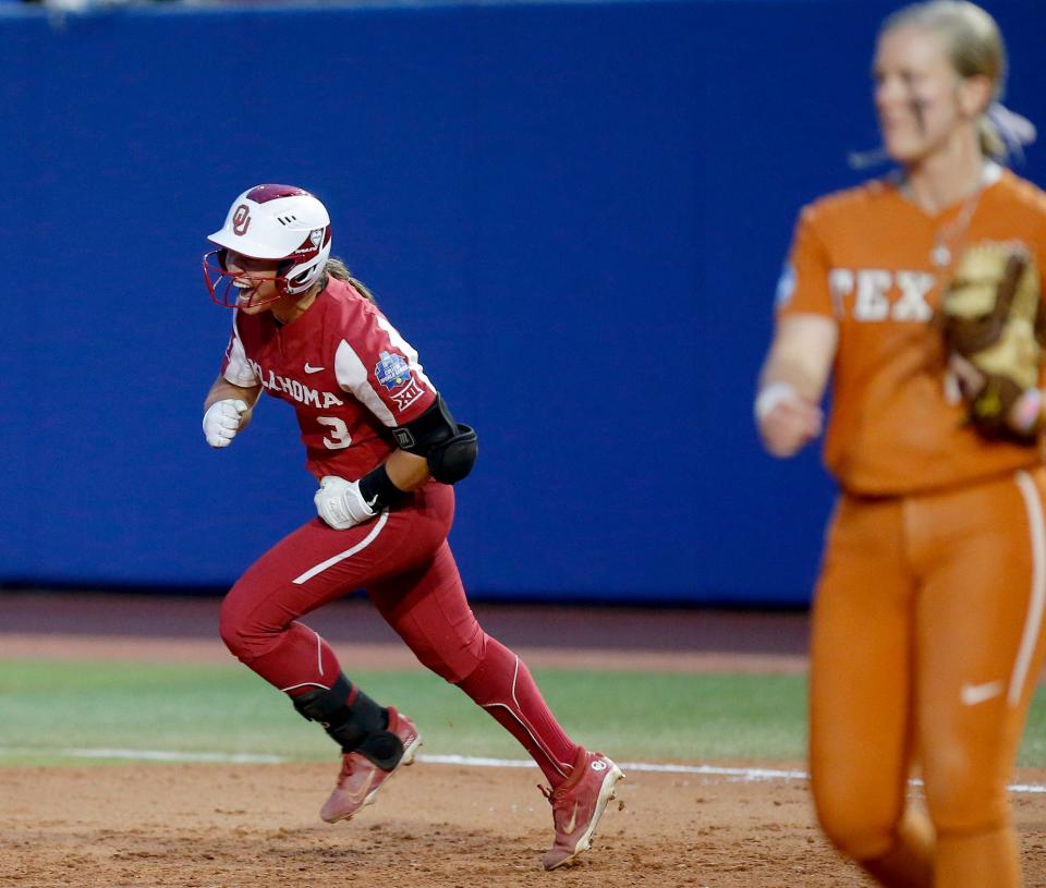 OU's Grace Lyons (3) celebrates her home run as she round first base next to Texas' JJ Smith (18) in the sixth inning of a 10-5 win on June 9.