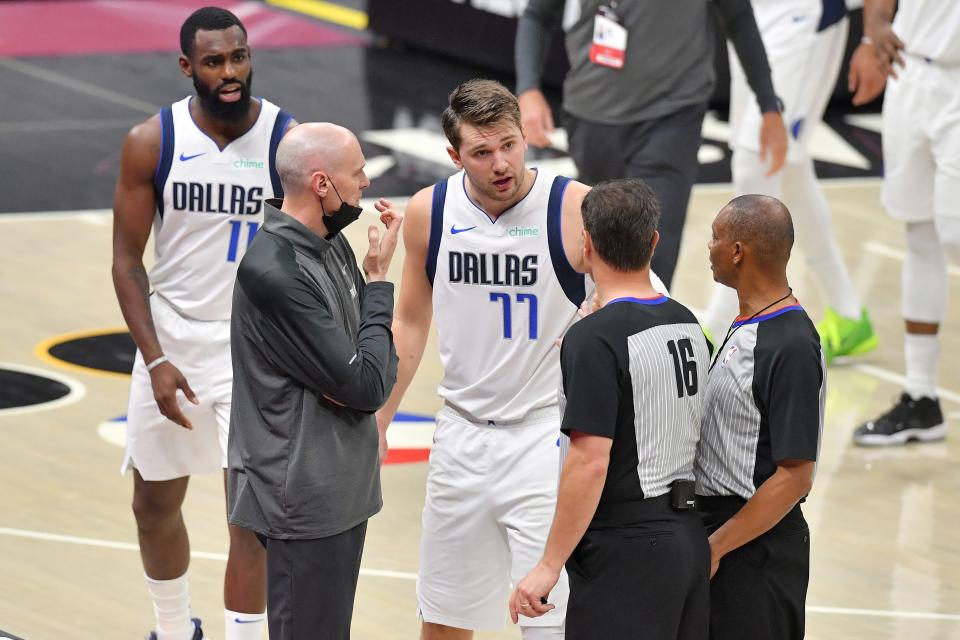 Luka Doncic and Rick Carlisle plead their case with the officials after Doncic was a assessed a flagrant foul 2 and ejected.