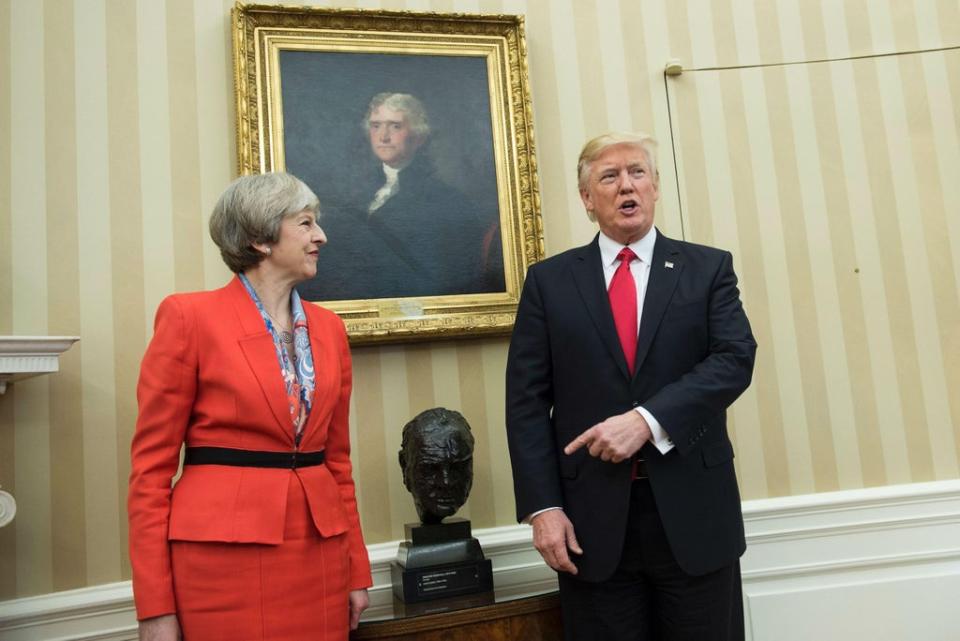 Theresa May and Donald Trump meet beside a bust of former British Prime Minister Winston Churchill in the Oval Office of the White House on January 27, 2017 (Getty)