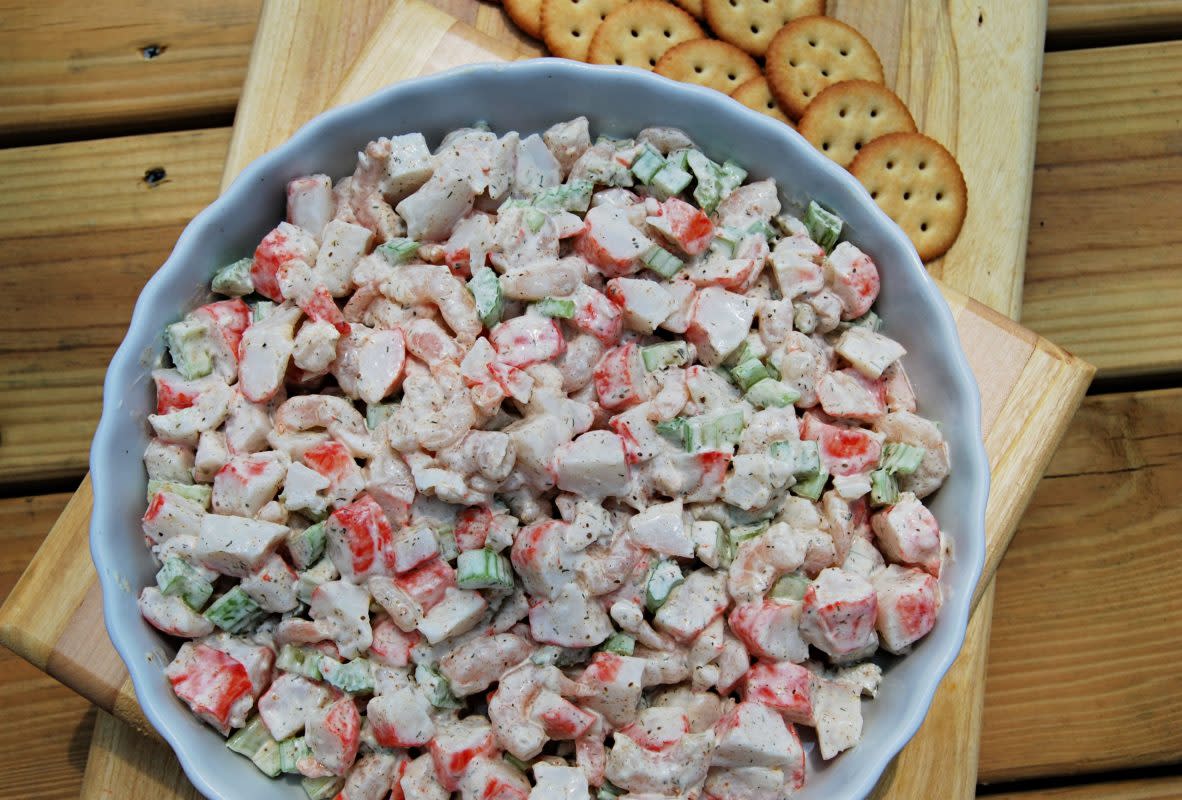 <p>Krista Marshall</p><p>Perfect with crackers or pita chips, this creamy cool salad brings the ocean to your backyard.</p><p><strong>Get the recipe: <a href="https://parade.com/907009/kristamarshall/chilled-seafood-salad-is-the-ideal-dish-for-hot-nights/" rel="nofollow noopener" target="_blank" data-ylk="slk:Seafood Salad;elm:context_link;itc:0;sec:content-canvas" class="link rapid-noclick-resp">Seafood Salad</a></strong></p>