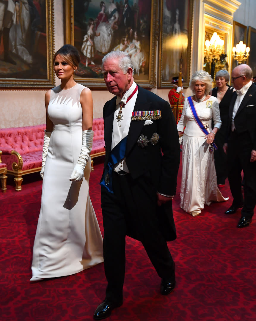 Melania Trump opted for another all-white ensemble at the state banquet on June 3. This time, she chose a sweeping Dior gown with co-ordinating elbow-high gloves. Her hair was swept back in the same chic way as earlier in the day. [Photo: Getty]