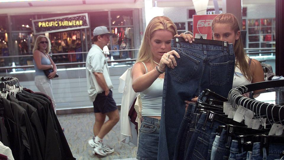 erin dwyer, 16, left, and lauren semchenko, 15, shop for clothes inside rave stoe located inside pac