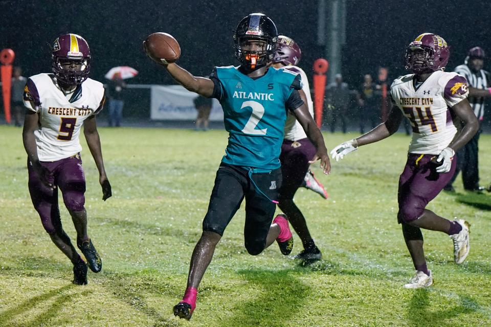Atlantic's Kwasie Kwaku Jr trots into the endzone to score a second quarter touchdown during a game with Crescent City at Atlantic High School, Thursday, Oct. 12, 2023.