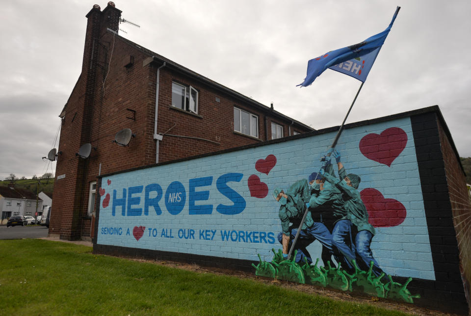 An Iwo Jima Memorial inspired NHS Heroes Mural by artists Ricky Morrow and Dee Craig in the village of Glynn near Larne, in County Antrim.
On Tuesday, April 20, 2021, in Glynn, County Antrim, Northern Ireland (Photo by Artur Widak/NurPhoto via Getty Images)