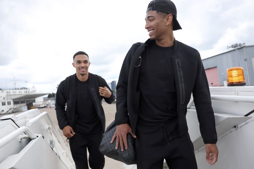 Trent Alexander-Arnold and Jude Bellingham of England board the plane as the England team travel to Germany ahead of their Euro 2024 campaign, at Birmingham Airport on June 10, 2024 in Birmingham, England.