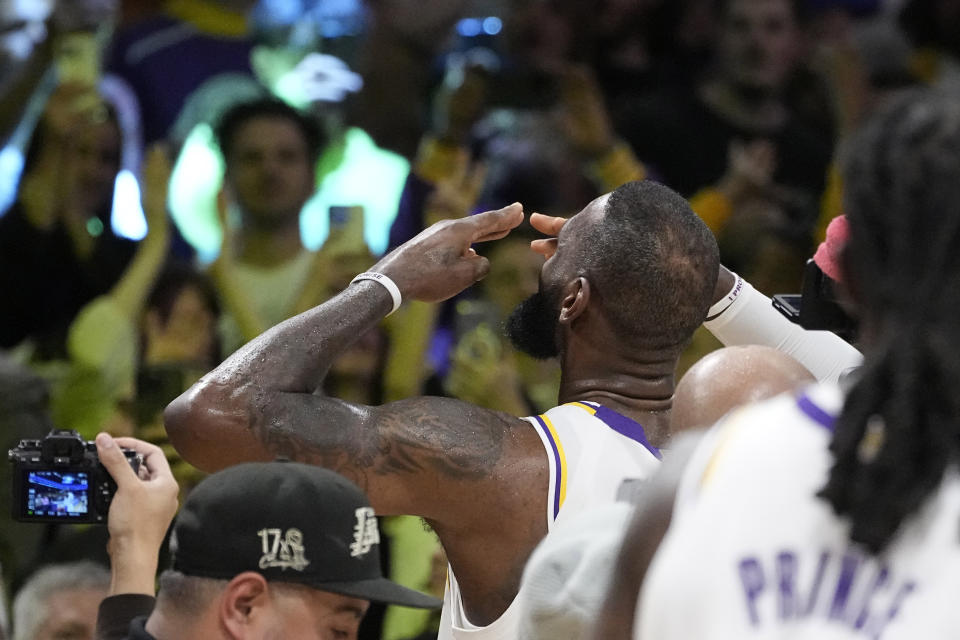 Los Angeles Lakers forward LeBron James acknowledges fans after scoring to become the first NBA player to reach 40,000 points in a career during the first half of an NBA basketball game against the Denver Nuggets Saturday, March 2, 2024, in Los Angeles. (AP Photo/Mark J. Terrill)