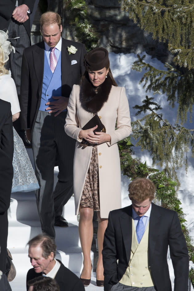 Kate Middleton attended a wedding in Switzerland in this gorgeous outfit. We especially love the fur scarf. Copyright [Splash]