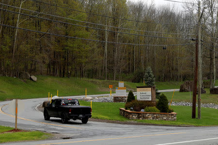 FILE PHOTO: A vehicle passes the entrance to the Federal Correctional Institution, Otisville where Michael Cohen, the former lawyer for U.S. President Donald Trump will be imprisoned beginning May 6, 2019 is seen in Otisville, New York, U.S. April 30, 2019. REUTERS/Mike Segar/File Photo