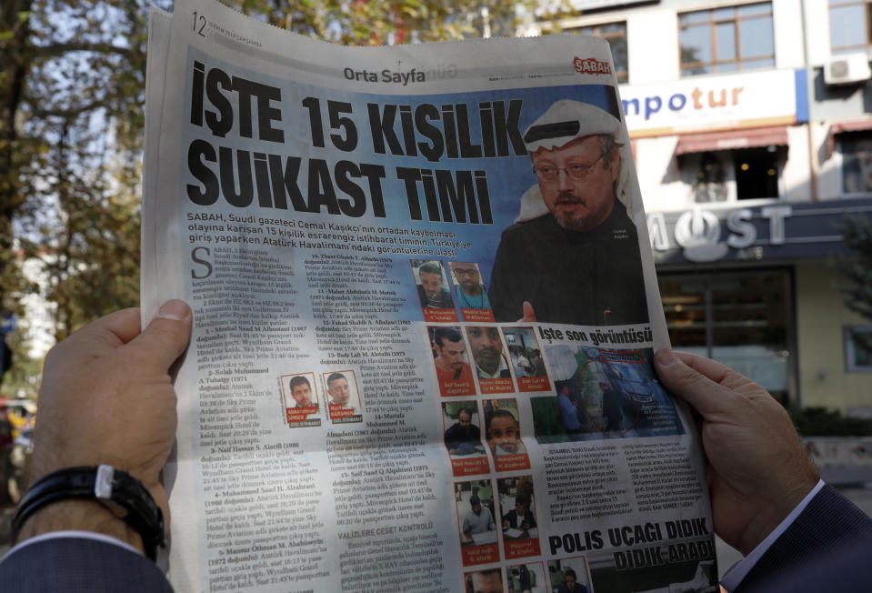 A man reads the Sabah newspaper, with a headline that reads "15-member assassination squad " in Ankara, Turkey, Wednesday, Oct. 10, 2018. Sabah on Wednesday revealed the identities of what it called a "mysterious" 15-member "assassination squad" who were allegedly involved in Saudi writer and government critic Jamal Khashoggi's disappearance inside his country's consulate in Istanbul. (AP Photo/Burhan Ozbilici)