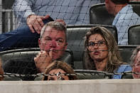 Former Atlanta Braves player and baseball Hall of Fame member Chipper Jones, left, and his wife Taylor watch a baseball game between the Braves and the Tampa Bay Rays, Saturday, July 17, 2021, in Atlanta. (AP Photo/John Bazemore)