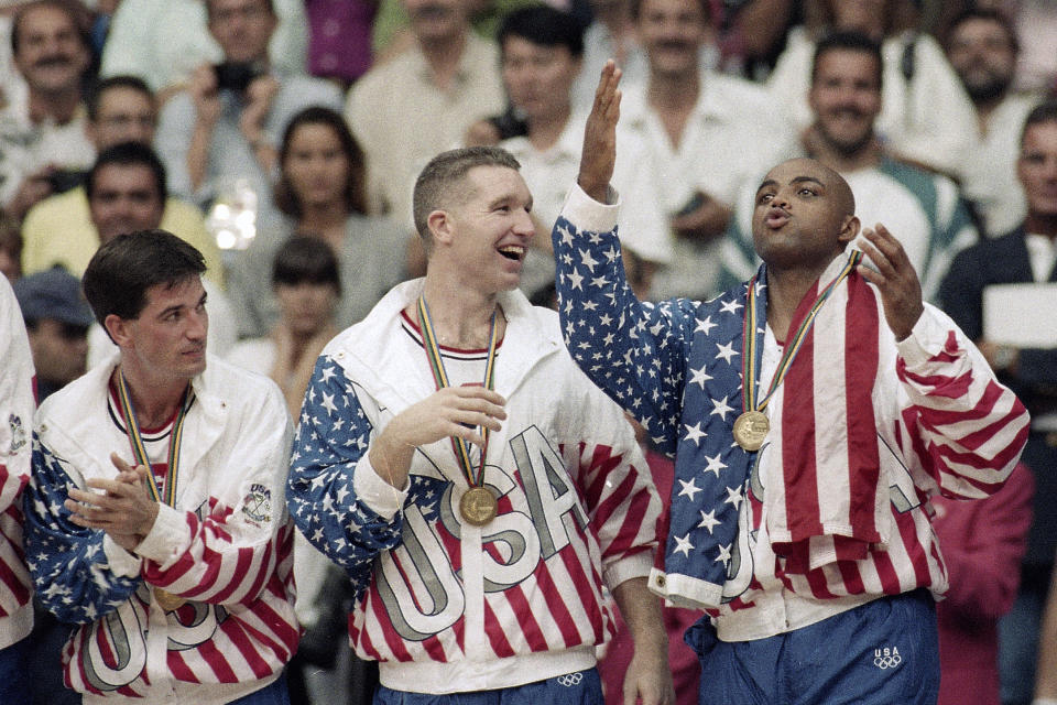 FILE - USA's John Stockton, from left, Chris Mullin and Charles Barkley rejoice with their gold medals after beating Croatia 117-85 in the gold medal game in men's basketball at the Summer Olympics in Barcelona on Aug. 8, 1992. The "Dream Team" with the first U.S. Olympic men's basketball team to field active NBA players rolls past Croatia 117-85 for the gold medal at the 1992 Barcelona Games. The Americans demolish the field. (AP Photo/John Gaps III, File)