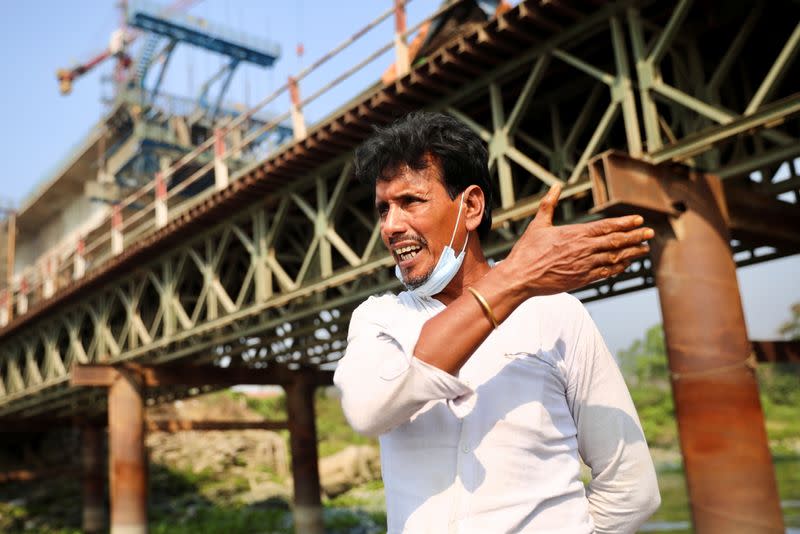 A relative of victims reacts after several people died as a ferry collided with a cargo vessel and sank on Sunday in the Shitalakhsyaa River in Narayanganj