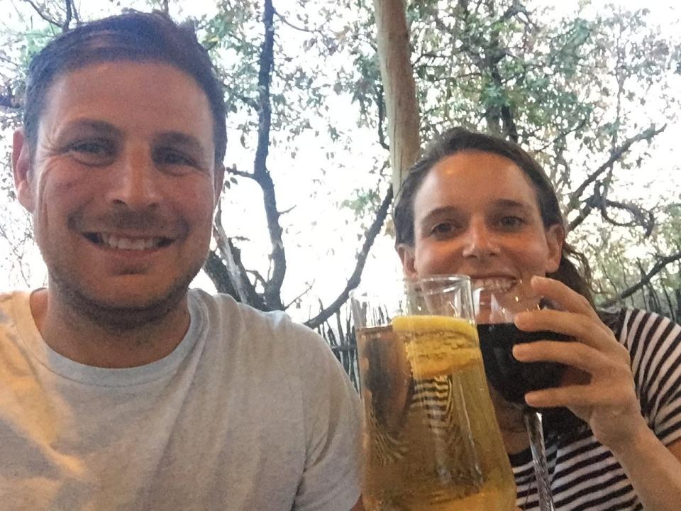 Ash Jurberg and his wife, Cecilia, smiling and looking at the camera