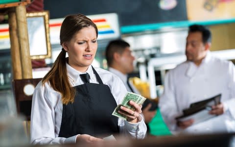 Tipping waitress - Credit: Getty