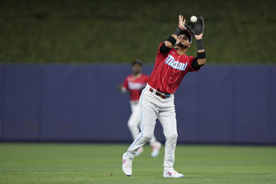 Miami Marlins second baseman Luis Arraez catches a ball hit by Washington Nationals' Joey Meneses during the first inning of a baseball game, Saturday, Aug. 26, 2023, in Miami. (AP Photo/Wilfredo Lee)