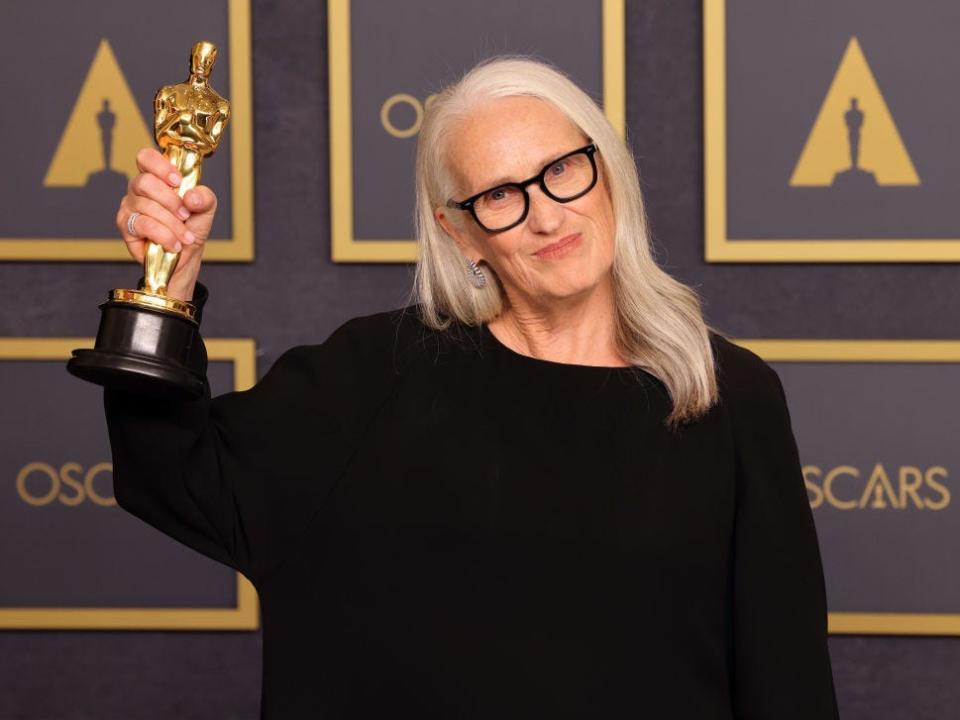 Jane Campion holds her Oscar for best director