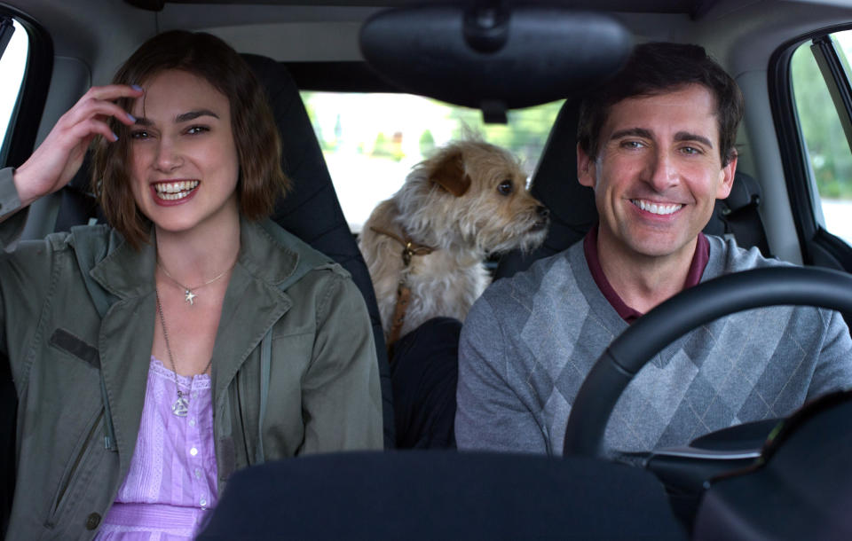 Keira Knightley and Steve Carell driving and smiling in seeking a friend for the end of the world