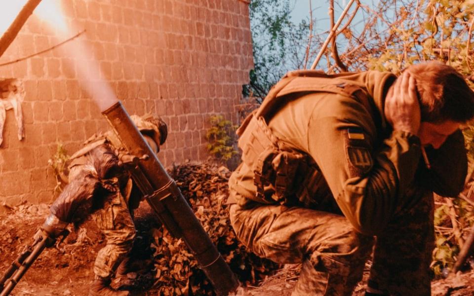 A 120mm mortar team fires shells at Russian positions in Chasiv Yar, Ukraine, April 27.