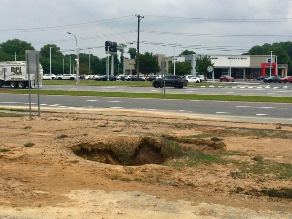 Leaking sewage caused a sinkhole about 12 feet in diameter along Route 13 in Dover June 4, 2024.