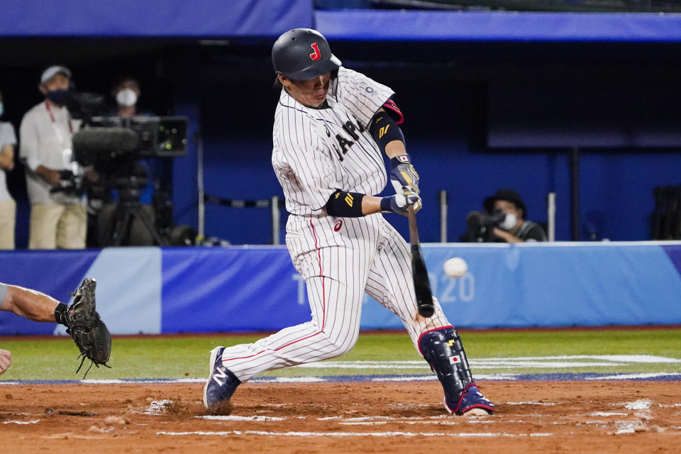Japan's Takuya Kai hits during the tenth inning of a baseball game against the United States at the 2020 Summer Olympics, Monday, Aug. 2, 2021, in Yokohama, Japan. Japan won 7-6. (AP Photo/Sue Ogrocki)