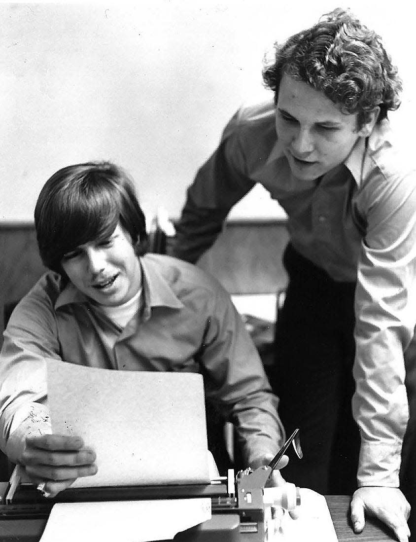 In this 1970's file photo, Ron Sachs, left, the former editor of the Florida Alligator, talks with former managing editor Gary Grunder in the Alligator newsroom.