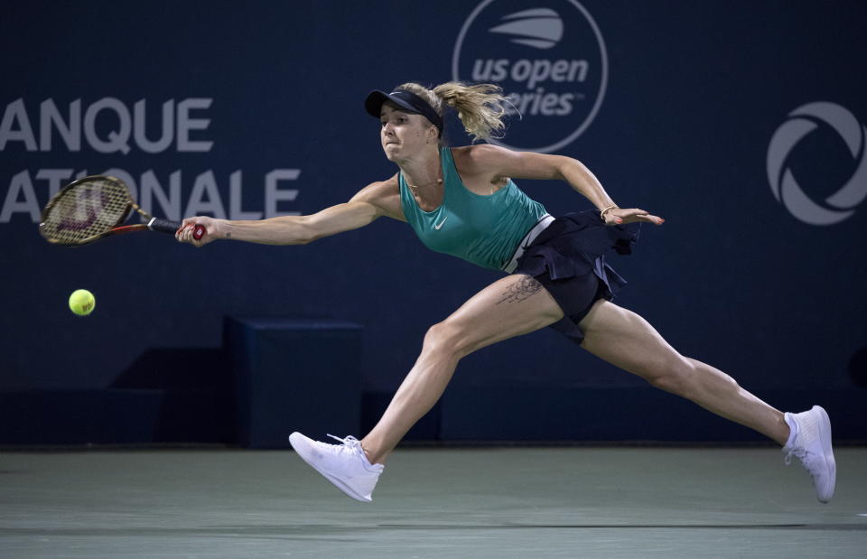 Elina Svitolina, of Ukraine, reaches for a shot from Elise Mertens, of Belgium, during the Rogers Cup women’s tennis tournament in Montreal, Friday, Aug. 10, 2018. (Paul Chiasson/The Canadian Press via AP