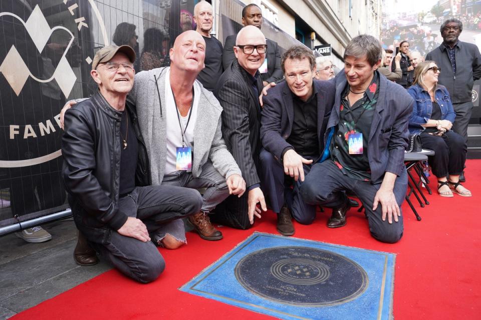 22 September 2022: Woody Woodmansey, Lee Bennett, Kevin Armstrong, Nick Moran and Clifford Slapper attend the unveiling of a stone for David Bowie on the Music Walk of Fame at Camden, north London (PA)