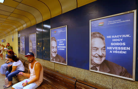 Hungarian government poster portraying financier George Soros and saying "Don't let George Soros have the last laugh" is seen at an underground stop in Budapest, Hungary July 11, 2017. REUTERS/Laszlo Balogh