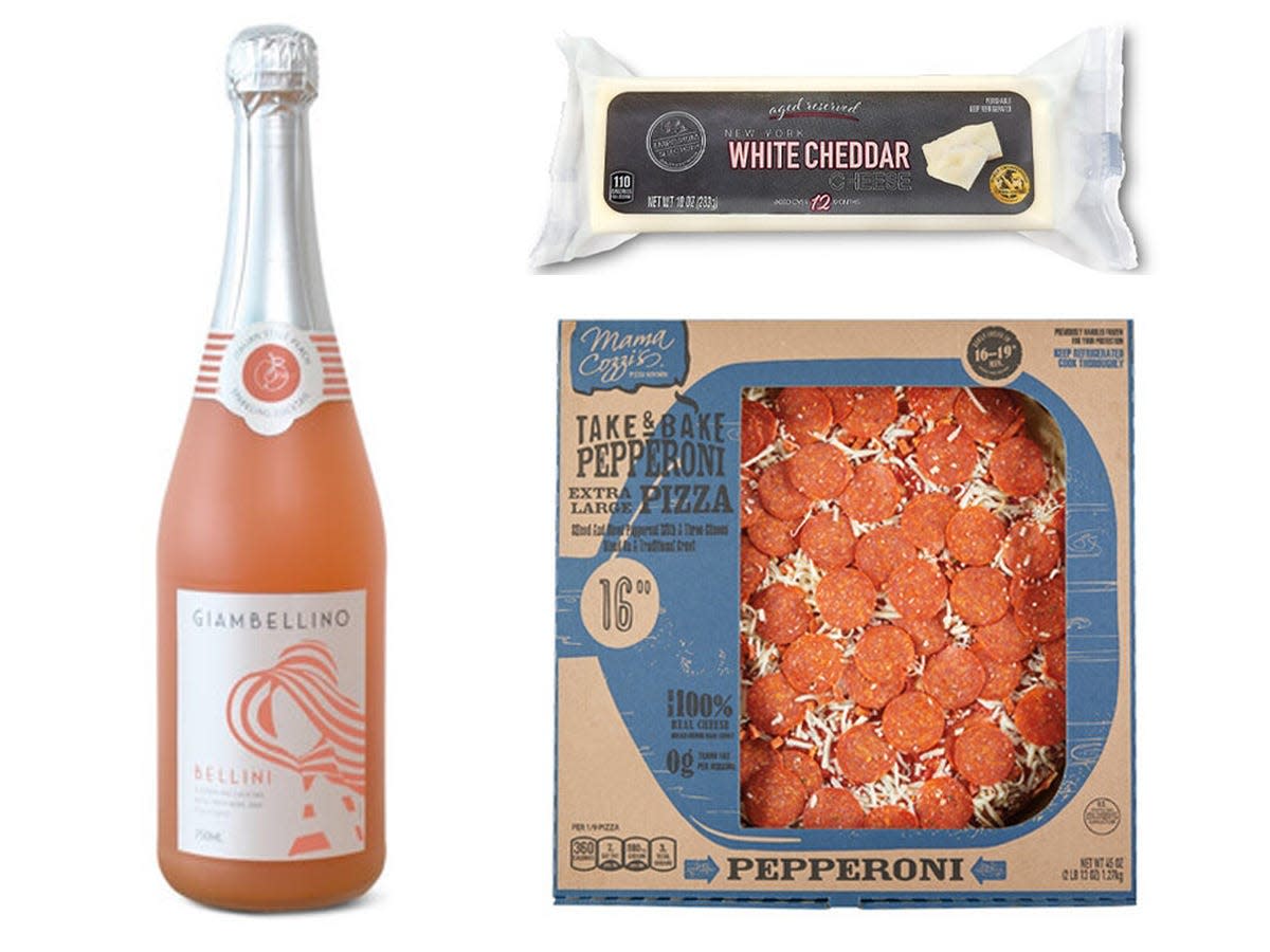 Bottle of belini, box of frozen pizza, and rod of white cheddar from Aldi