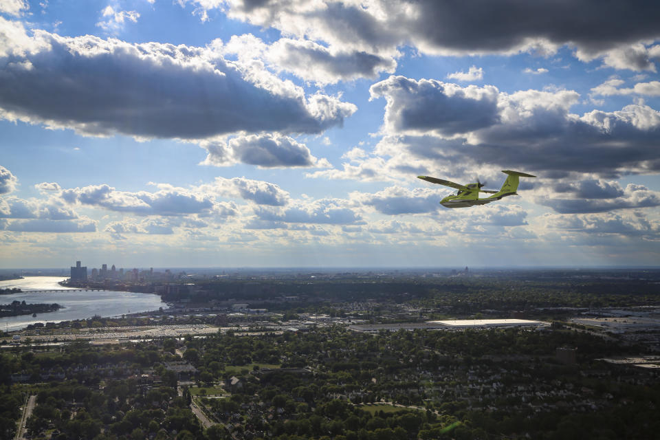 This photo provided by ICON Aircraft shows an ICON A5, a two-seat, amphibious, light-sport aircraft, flying above Detroit on Thursday, Sept. 15, 2022. ICON Aircraft is one of the companies displaying their flying vehicles at the North American International Auto Show as part of the event's Air Mobility Experience segment. (ICON Aircraft via AP)