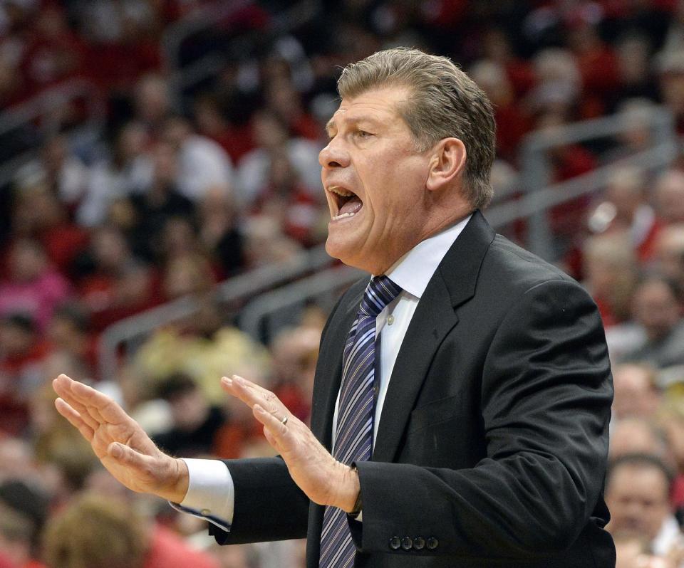 Connecticut head coach Geno Auriemma shouts instructions to his team during the first half of an NCAA college basketball game against Louisville, Monday, March 3, 2014, in Louisville, Ky. (AP Photo/Timothy D. Easley)