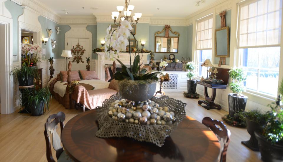 A bedroom and lounge area decorated in the theme of "Home for the Holidays" last year  at the 16th annual "Holidays at Highfield."