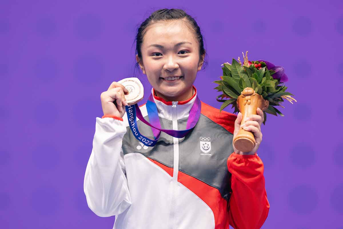 Singapore wushu athlete Kimberly Ong with her bronze medal in the women's changquan event at the 2023 Asian Games in Hangzhou. (PHOTO: SNOC/Eng Chin An)