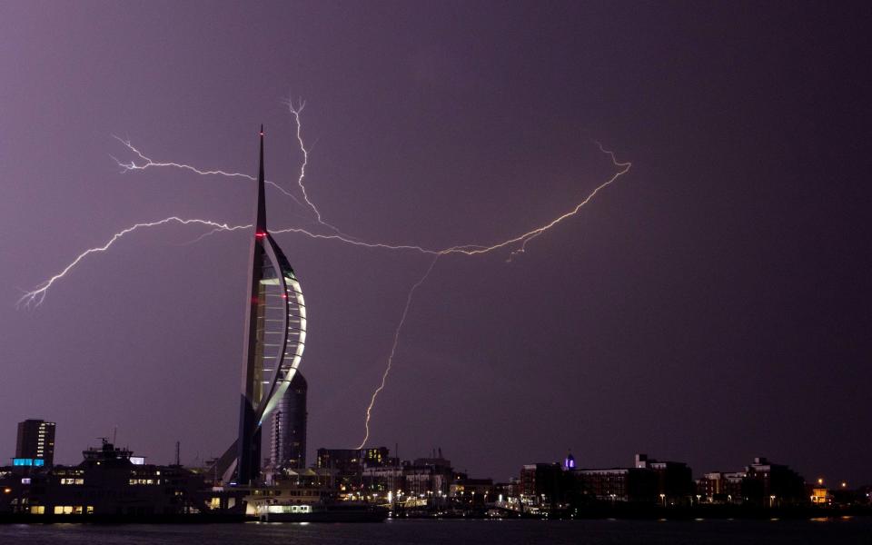 Lightning flashes near the Spinnaker Tower in Portsmouth  - Credit: PA