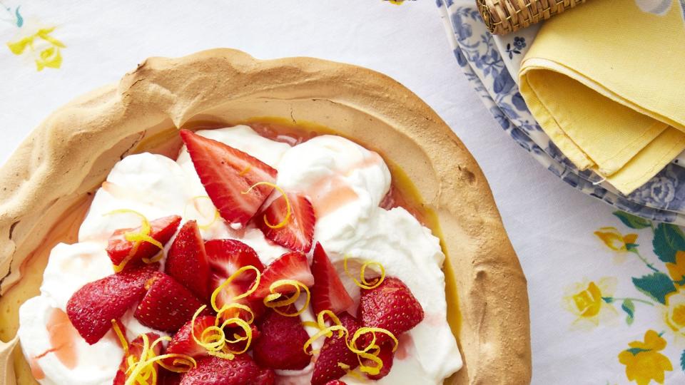 strawberry lemonade angel pie with a meringue crust and whipped cream and strawberries on top