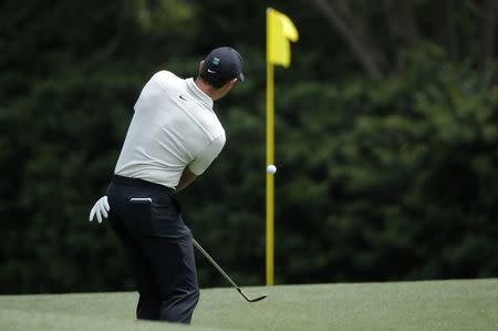 Rory McIlroy of Northern Ireland chips to the 11th green during second round play of the 2018 Masters golf tournament at the Augusta National Golf Club in Augusta, Georgia, U.S., April 6, 2018. REUTERS/Mike Segar