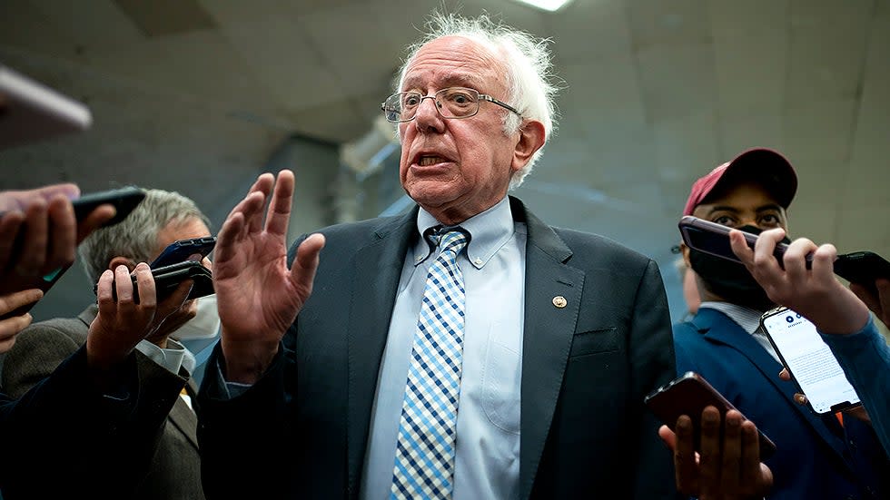Sen. Bernie Sanders (I-Vt.) speaks to reporters as he arrives to the Capitol for a series of votes including the final passage of the National Defense Authorization Act and a judicial nomination on Wednesday, December 15, 2021.