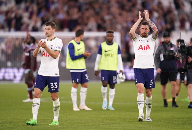 Tottenham players applaud the fans