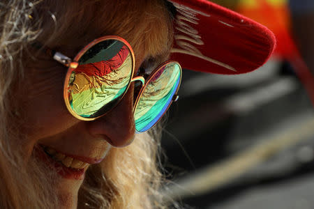 A rainbow flag is reflected in a participant's glasses during an annual LGBT (Lesbian, Gay, Bisexual and Transgender) pride parade in Belgrade, Serbia September 17, 2017. REUTERS/Marko Djurica